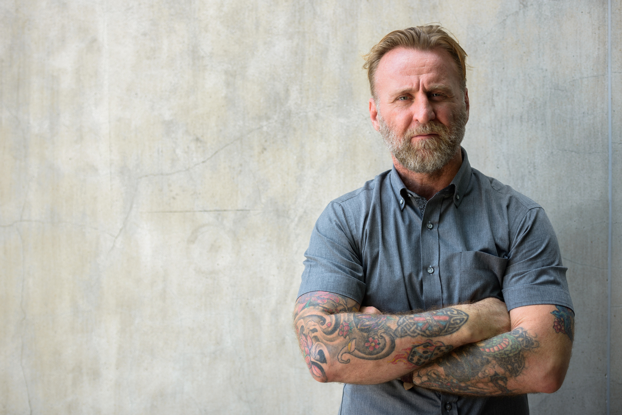Portrait Of Man Standing Against Wall LMCT | Mental Health Awareness | Breaking Stereotypes